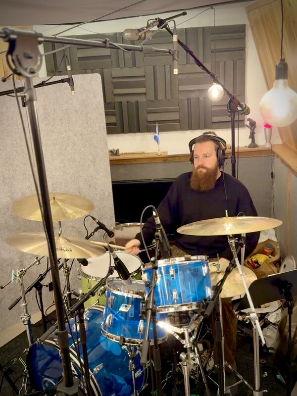 Flo tracking drums on the blue acrylic kit