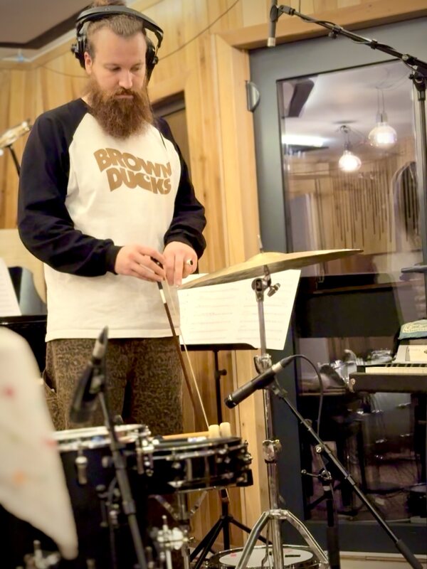 Flo bowing a cymbal